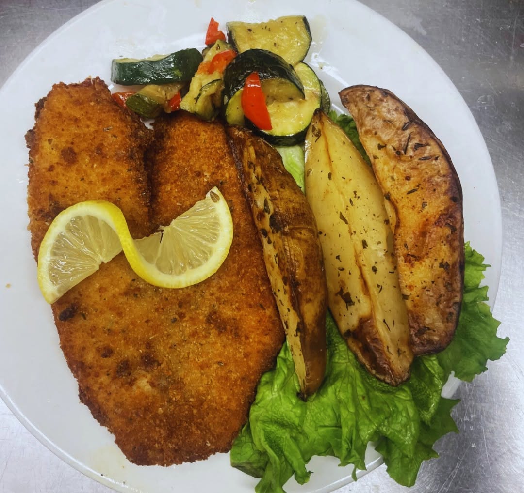 Dining plate fish at Advinia Care Naples